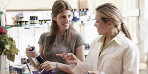 Customer in a store speaking with an employee